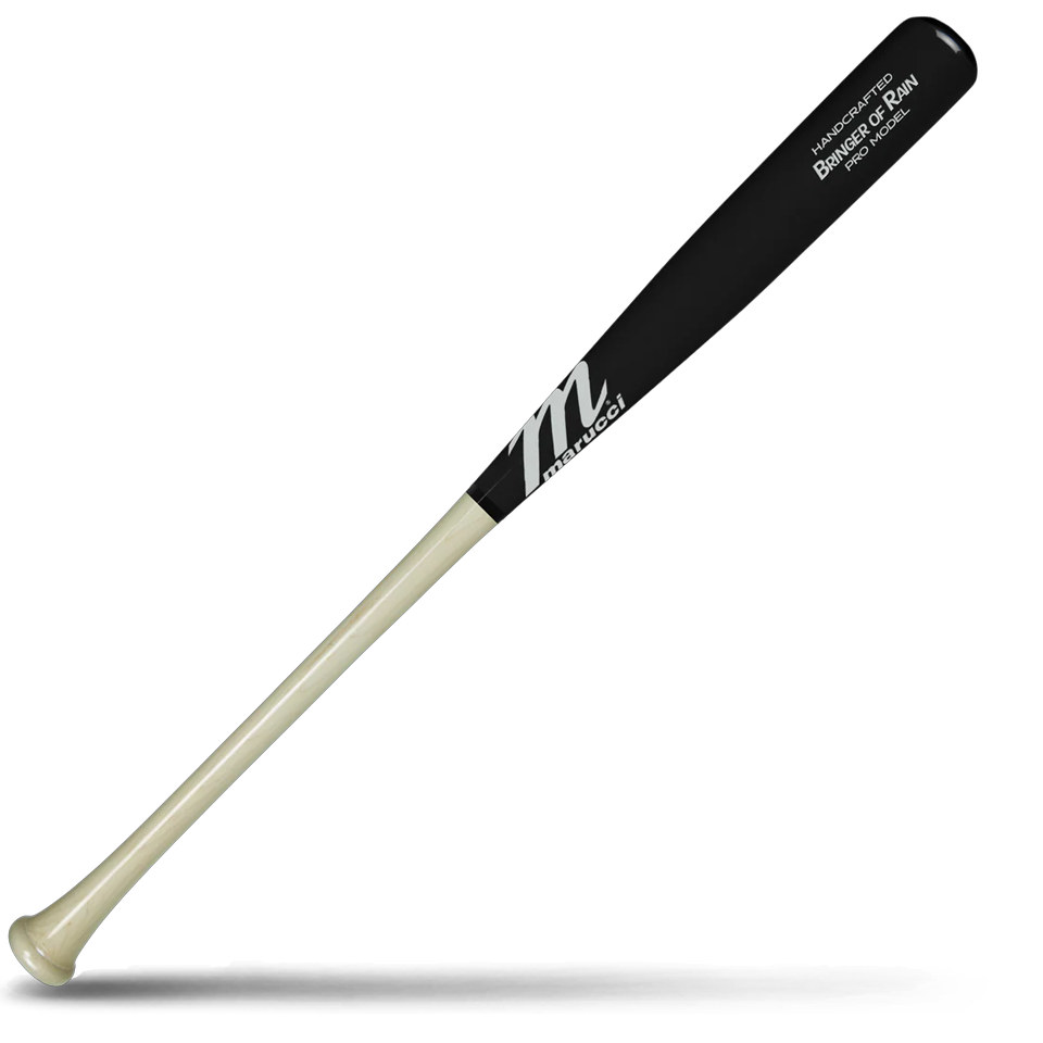 A two-tone maple wood baseball bat with a black barrel and a light natural wood handle, featuring Marucci branding and Josh Donaldson “Bringer of Rain” Pro Model markings, lying diagonally on a white background with a shadow underneath.