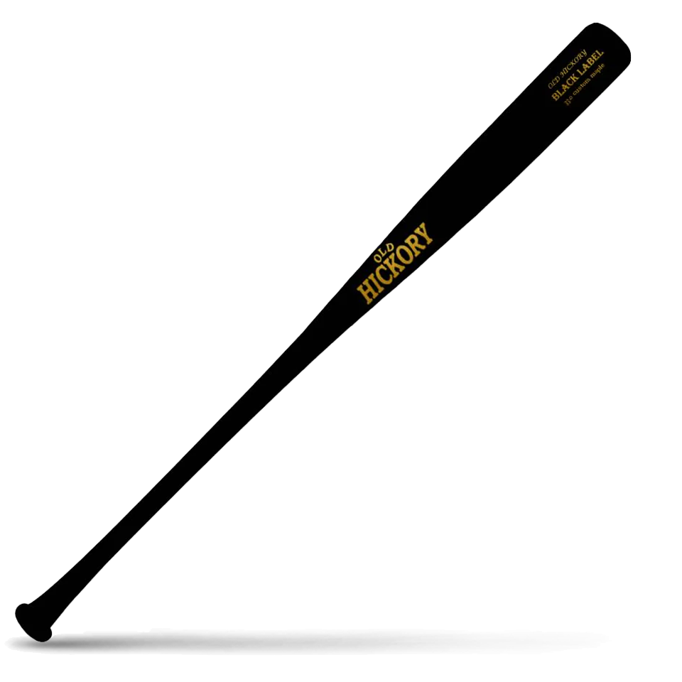 A black wooden baseball bat (Old Hickory Black Label) with gold lettering, lying diagonally on a white background with a shadow underneath.